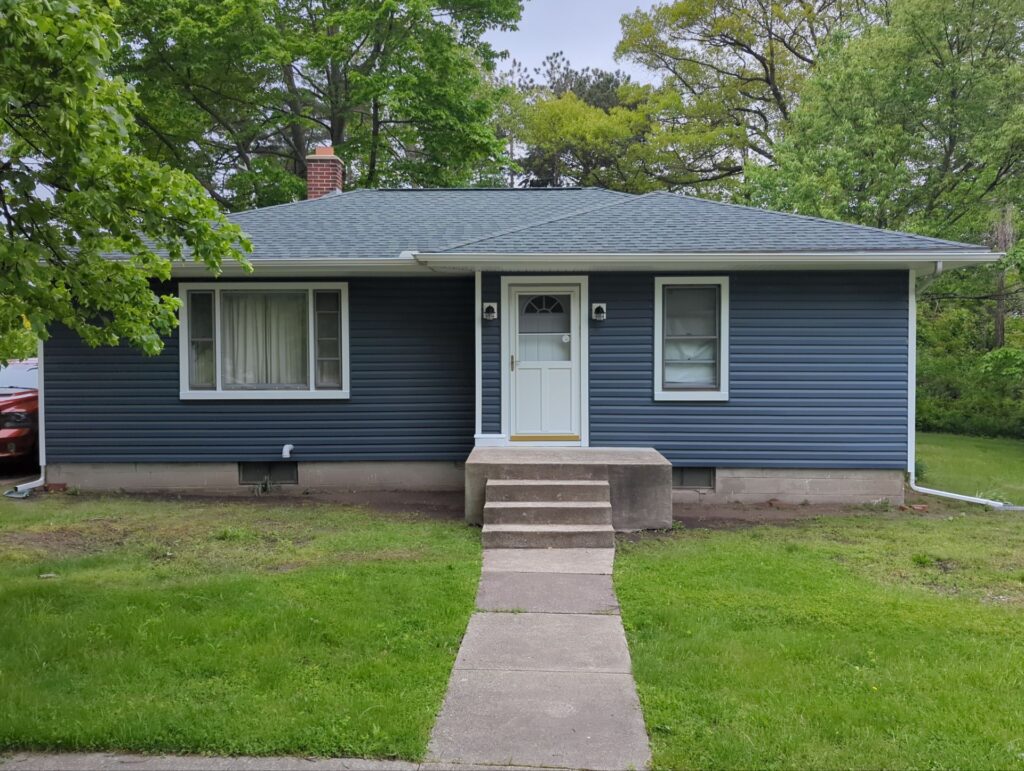 Blue vinyl siding on house