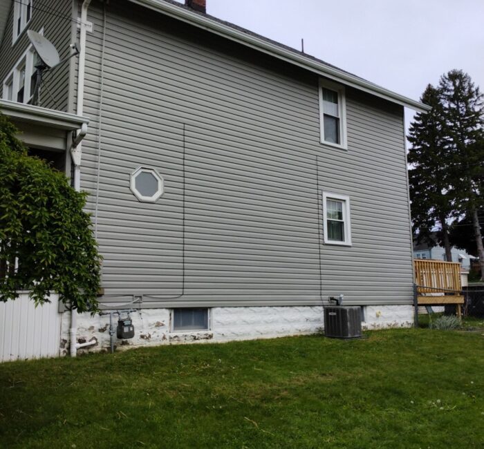 Siding on a two story house installed quickly by Bauer Specialty